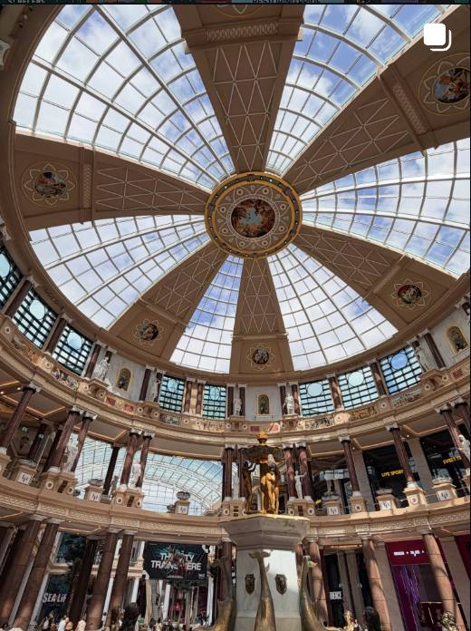 Ornate glass dome ceiling of a Victorian shopping arcade
